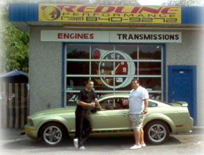 Daryl and Aldo McCoy in front of the 2006 Mustang.